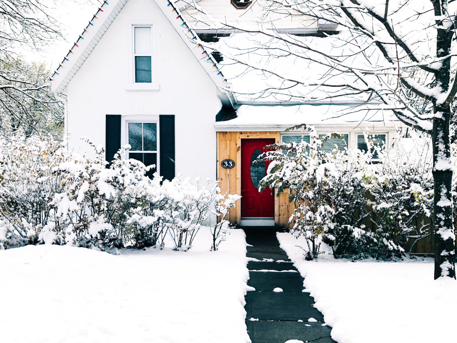 Exterior of white house after a snowfall