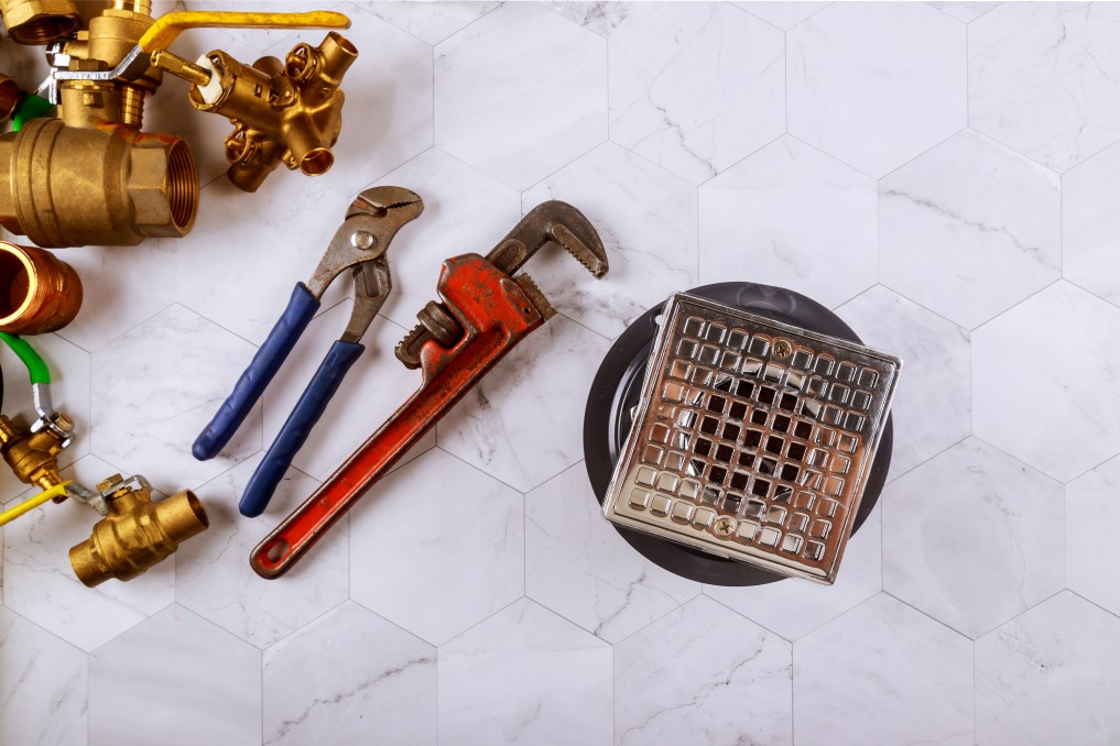 Plumbing tools by a drain