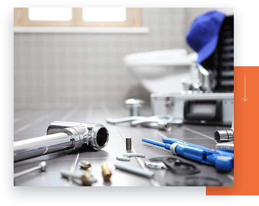 plumbing tools on a bathroom floor