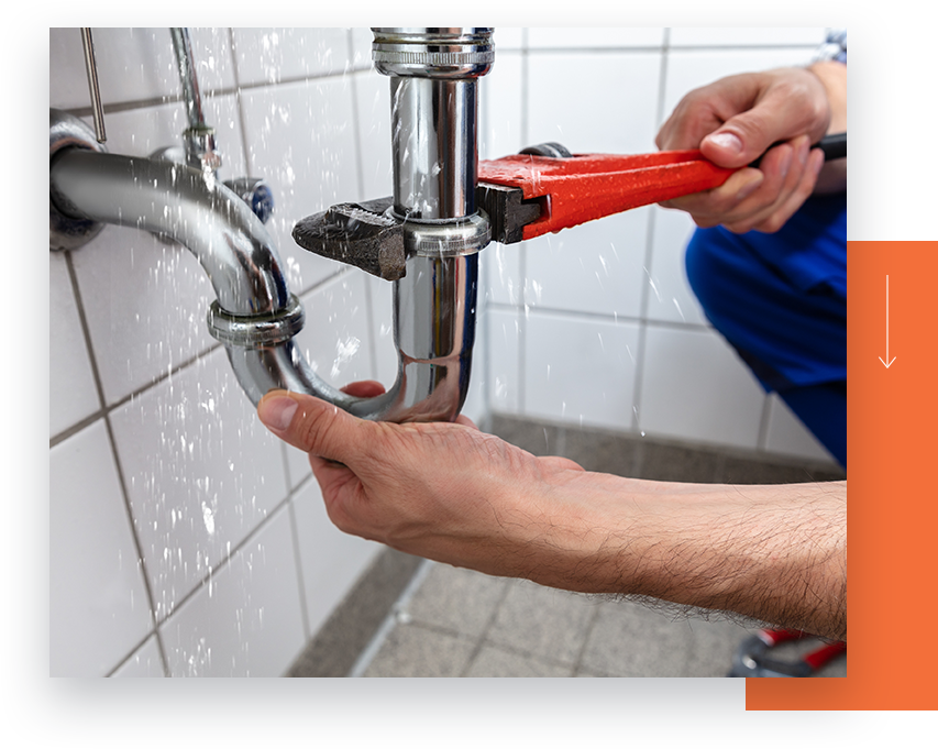 A technician stopping a leaking pipe